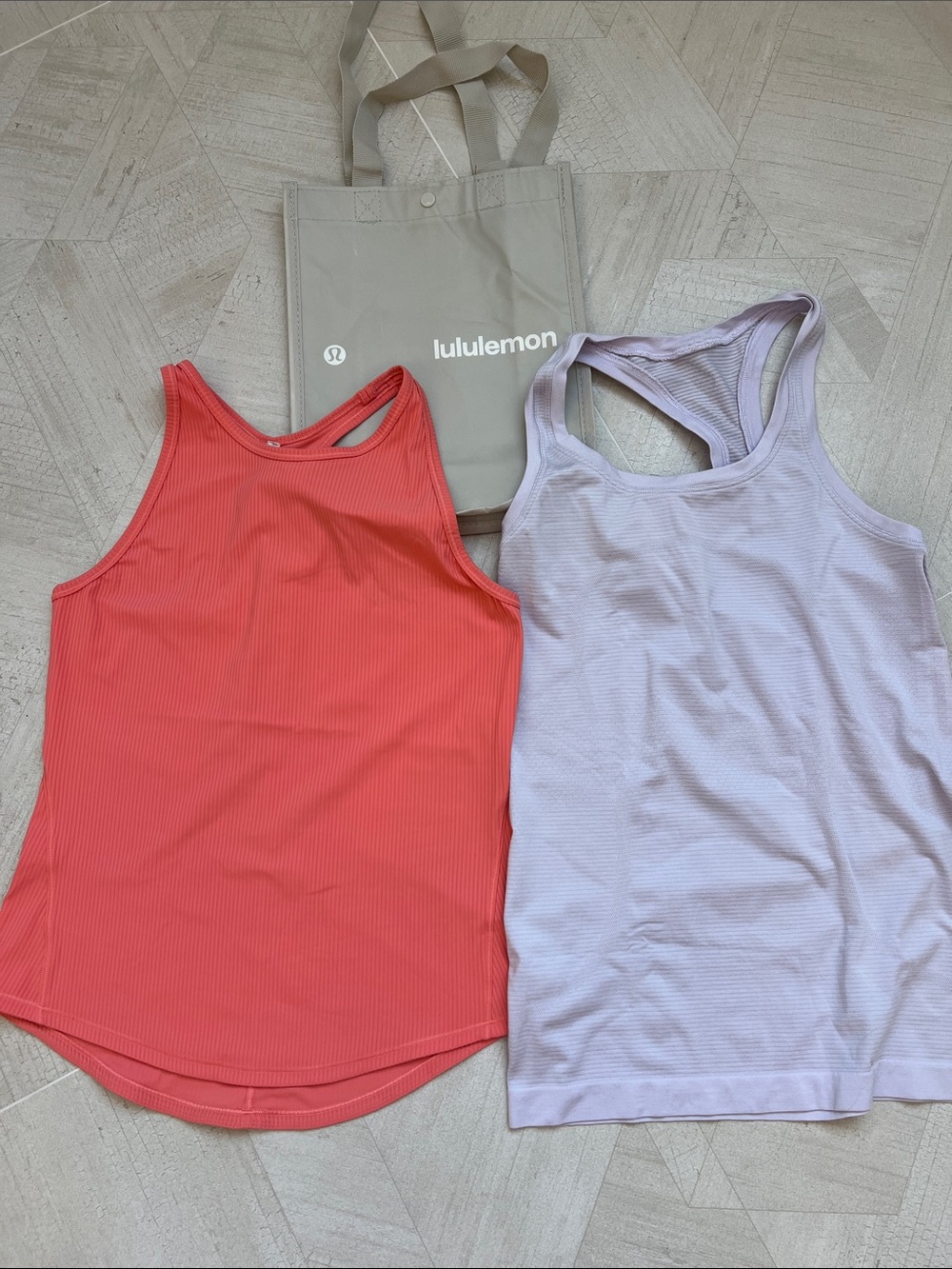 Two (2) Lululemon tank tops